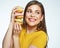 Toothy smiling young woman holding pile cake.