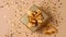 Top above overhead close up view photo of beautiful present box with golden yellow ribbon on background with shiny confetti soft