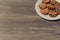 Top above overhead close up view photo of tasty yummy delicious crunchy crispy cookies with chocolate on whute round plate isolate