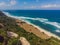 Top aerial view of beauty Bali beach. Empty paradise beach, blue sea waves in Bali island, Indonesia. Suluban and Nyang