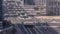 Top aerial view of busy road intersection and traffic junctions in Dubai city timelapse.