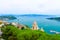 Top aerial view of Gulf of Spezia turquoise water, dome of Chiesa di San Lorenzo church in Portovenere