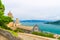 Top aerial view of Gulf of Spezia turquoise water, dome of Chiesa di San Lorenzo church in Portovenere