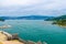 Top aerial view of Gulf of Spezia turquoise water, Portovenere castle ancient walls, Palmaria island green hills