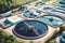 Top aerial view of purification tanks of modern wastewater treatment plant