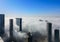 Top aerial view shot of skyscrapers in the city with fog clouds passing by - Abu Dhabi Al Reem island Sun and Sky towers