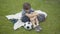 Top angle view of frustrated Caucasian boy sitting with head on knees, pushing away soccer ball, and leaving. Portrait