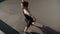 Top angle view of gorgeous slim ballerina performing in urban stairs in sunlight. Charming confident Caucasian woman