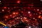 Top of the canopy in a red textile gazebo with string light garland.