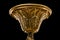 Top cap of chandelier. Contemporary gold chandelier isolated on black background. close-up detail . Crystal chandelier.