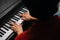 Top close-up view of hands of unrecognizable musician man playing on piano at home.