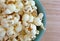 Top close view of a bowl of white cheddar cheese popcorn