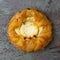 Top close view of a delicious cream cheese danish on a gray mottled tabletop