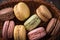 Top close view macaroons on wicker basket background