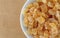 Top close view of a small bowl filled with dried diced peaches