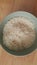 Top closeup view of heap of rice in a ceramic bowl