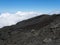 on top of the clouds in the lava flows on the way to Dolomieu crater, Fournaise volcano