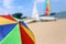 Top of a Colorful Beach Umbrella against the Sky and boat and sea