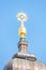 Top cross at Church of Our Lady at Neumarkt square in downtown of Dresden in summer sunny day with blue sky, Germany, details,