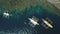 Top down aerial view of boats at cliff ocean shore, sand beach at coast. Tropic mountain isle