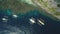 Top down aerial view of boats at cliff ocean shore, sand beach at coast. Tropic mountain isle