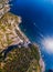 Top down aerial view from distance, general view of the area Manarola and Riomaggiore. boats and rocky beach. Province of La