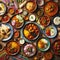 Top down aerial view of several Indian dishes served on wooden surface
