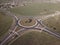 Top down aerial view of a traffic roundabout on a main road