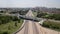 Top down aerial view of transportation highway overpass, ringway, roundabout