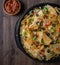 Top down of a baking sheet of nachos fresh out of the oven ready for sharing.