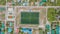 Top-down drone photo of the football pitch at the Maamigili tropical island at the Alif Dhaal Atoll at the indian ocean