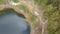 Top down drone view to Danau Abutu, Lake of the Older. The lake Tiwi Ata Mbupu on Kelimutu. Flight over the edge of a