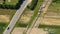 TOP DOWN: Flying above a long line of unassembled gas pipes laid along a road