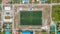 Top-down photo of the soccer pitch at the Maamigili tropical island at the Alif Dhaal Atoll at the indian ocean