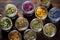 top down shot of an assortment of dried herbal tea in jars