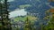 Top down shot of beautiful Walchensee Lake surrounded by small villages in valley in Bavaria during sunny day