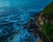 Top down sunrise seascape with rocks and headland