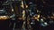 Top down of traffic road lit by lanterns at night illuminate aerial view. Metropolis cityscape