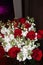 Top Down View of a Bouqet of Flowers with Red Roses and White Delphiniums