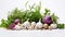 A top-down view of fresh garlic bulbs and an assortment of aromatic culinary herbs like rosemary, thyme, and basil