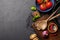 Top-down view of a kitchen table with ingredients, utensils, and copy space