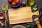 Top-down view of a kitchen table with ingredients, utensils, and copy space