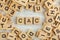 Top down view, pile of square wooden blocks with letters CAC stands for Customer acquisition cost on white board