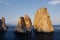 Top down view of rocks in Mediterranean sea. View from flying drone of the shore of Milazzo peninsula. Stunning spring