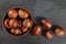 Top down view, small bowl with chestnuts on black slate board