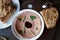 Top Down View of Smoked Chicken Liver Pate Served on a Round Plate with Bread