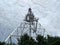 Top-down view of the telecommunication tower Overview botton on construction with down to top Sky with white clouds