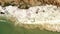 Top down view of Waves breaking on Empty Rocky beach Aerial