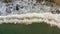 Top down view of Waves breaking on Empty Rocky beach Aerial