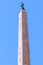 The top of the Egyptian Obelisk in Piazza Navona, Rome. A dove a